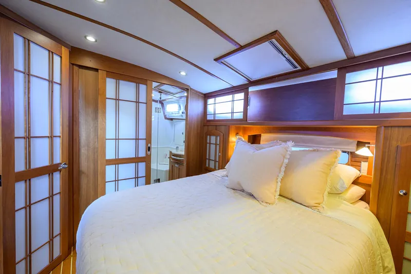 Slide: The Image of Luxurious bedroom interior of 2018 Sabre 48 Salon Express yacht with wooden accents. - 43