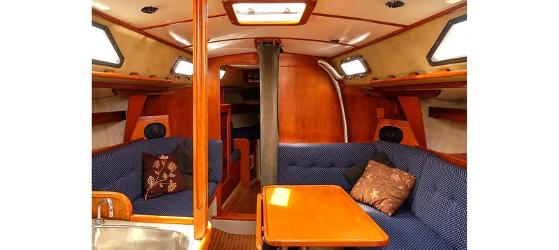 Slide: The Image of Interior of 1980 Sceptre 36 Brandywine yacht with cozy seating and wooden finishes. - 1