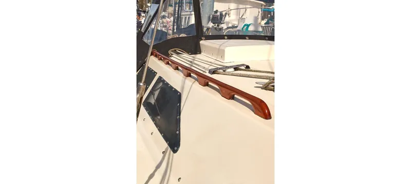 Slide: The Image of 1980 Sceptre 36 Brandywine sailboat deck with ropes and wooden trim. - 12