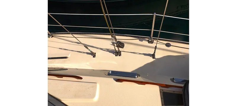 Slide: The Image of Deck of 1980 Sceptre 36 Brandywine sailboat with railing and fittings. - 14