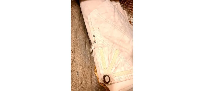 Slide: The Image of White fabric with decorative stitching and metal eyelets, Sceptre 36 Brandywine, 1980. - 23