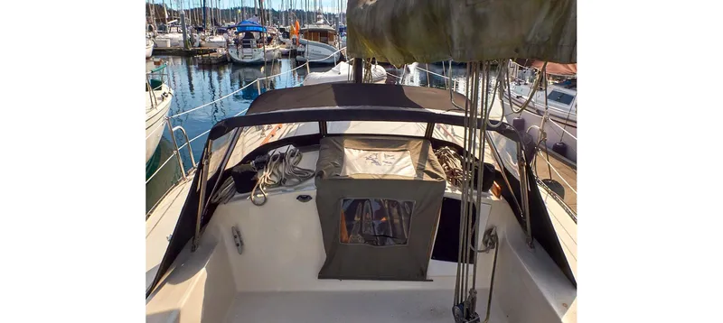 Slide: The Image of 1980 Sceptre 36 Brandywine sailboat docked in marina, featuring covered cockpit area. - 24