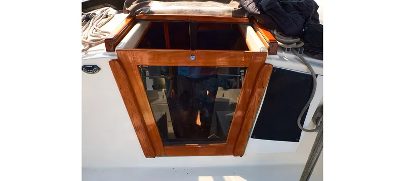 Slide: The Image of 1980 Sceptre 36 Brandywine yacht hatch with wooden frame and glass panel. - 29