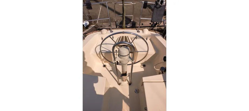 Slide: The Image of Cockpit of 1980 Sceptre 36 Brandywine sailboat with steering wheel and controls. - 32