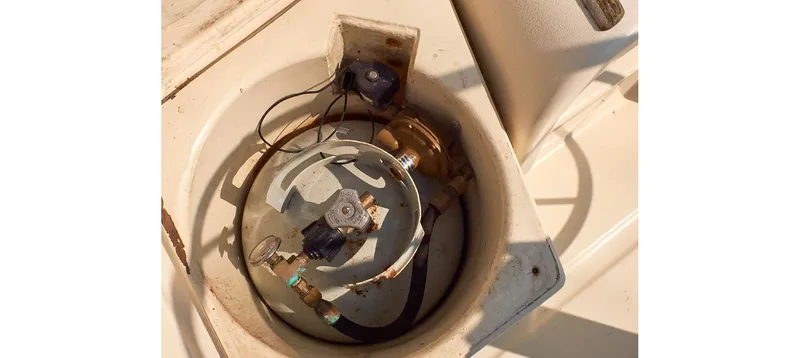 Slide: The Image of 1980 Sceptre 36 Brandywine boat component, featuring wiring and mechanical parts in a circular compartment. - 37