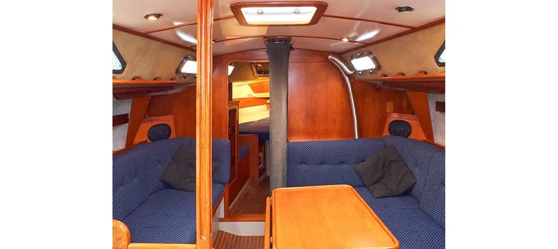 Slide: The Image of Interior of 1980 Sceptre 36 Brandywine sailboat with wood finish and blue seating. - 38