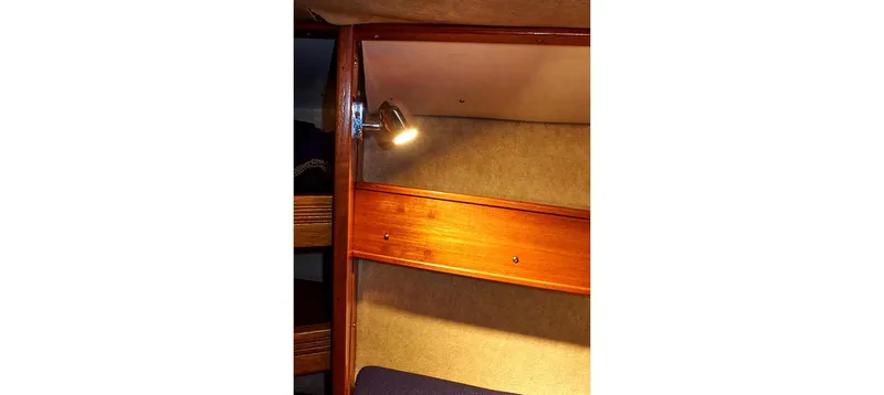 Slide: The Image of Interior cabin of 1980 Sceptre 36 Brandywine yacht with wooden paneling and reading light. - 44