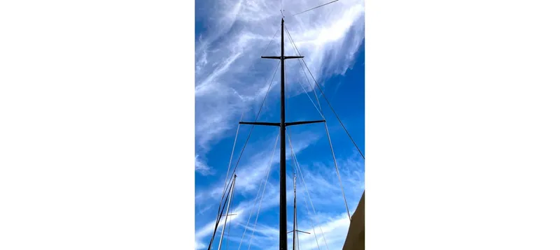 Slide: The Image of Tall sailboat mast against blue sky, Sceptre 36 Brandywine, 1980 model. - 9