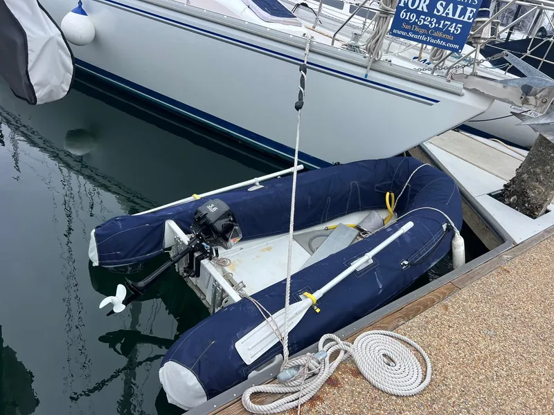 Slide: The Image of Inflatable dinghy moored beside a 2007 Catalina Morgan 440 sailboat. - 10