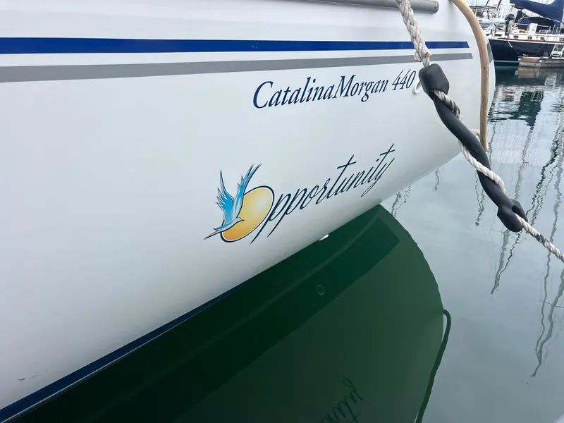 Slide: The Image of 2007 Catalina Morgan 440 sailboat named "Opportunity" docked in a marina. - 12