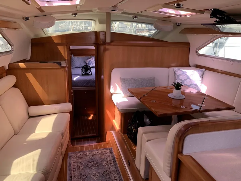 Slide: The Image of Luxurious interior of 2007 Catalina Morgan 440 yacht with elegant seating and dining area. - 18