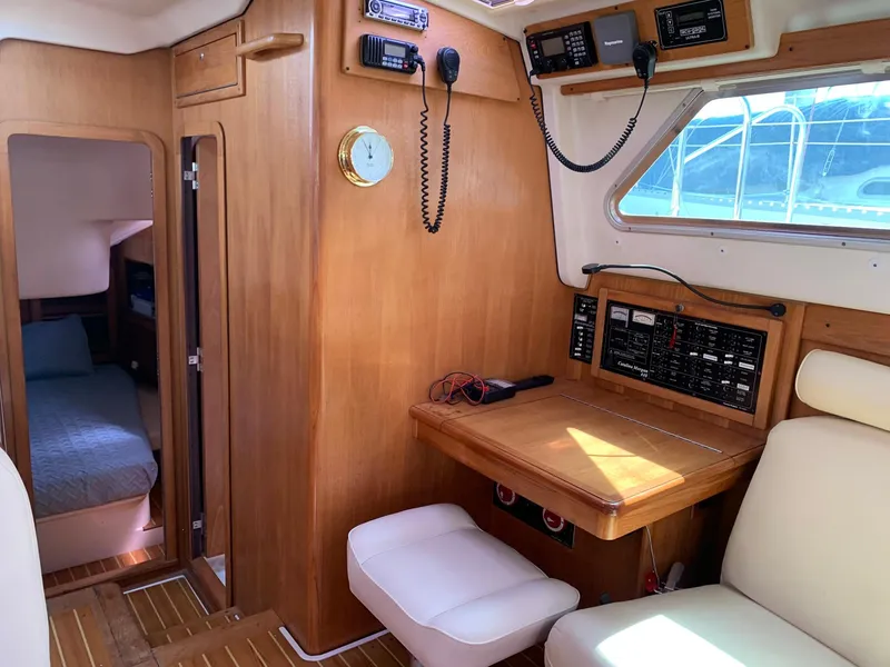 Slide: The Image of 2007 Catalina Morgan 440 yacht interior with navigation station and cozy cabin. - 22