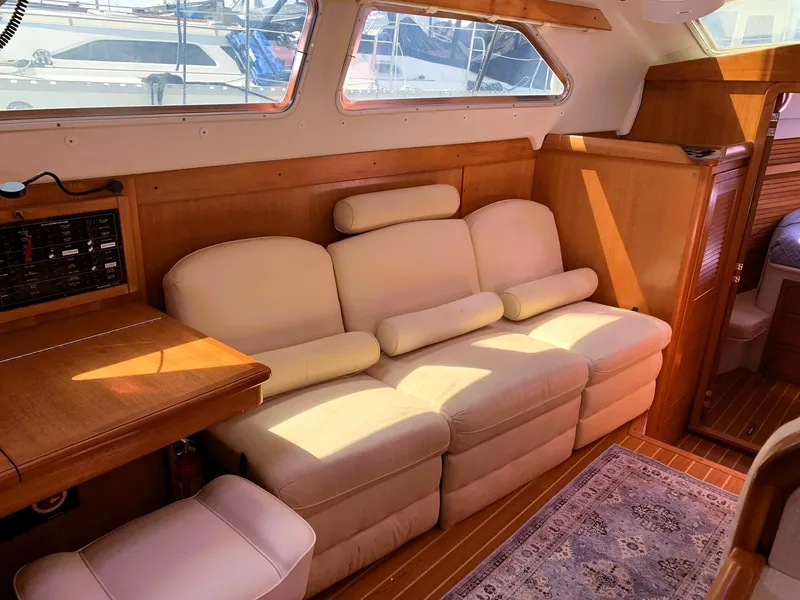 Slide: The Image of Luxurious interior of 2007 Catalina Morgan 440 yacht with cream leather seating and wooden accents. - 23