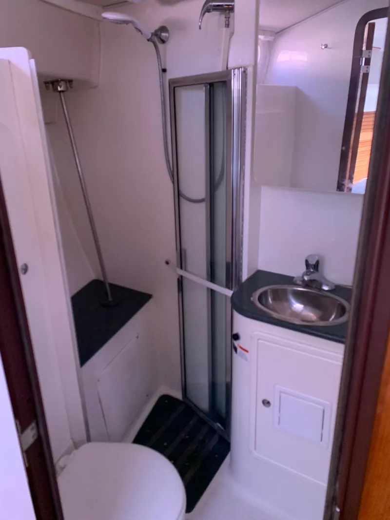 Slide: The Image of 2007 Catalina Morgan 440 yacht bathroom with shower, sink, and toilet. - 26