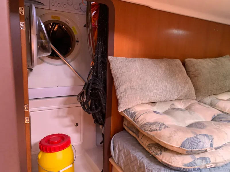 Slide: The Image of Interior of 2007 Catalina Morgan 440 yacht with washer, bedding, and storage. - 31