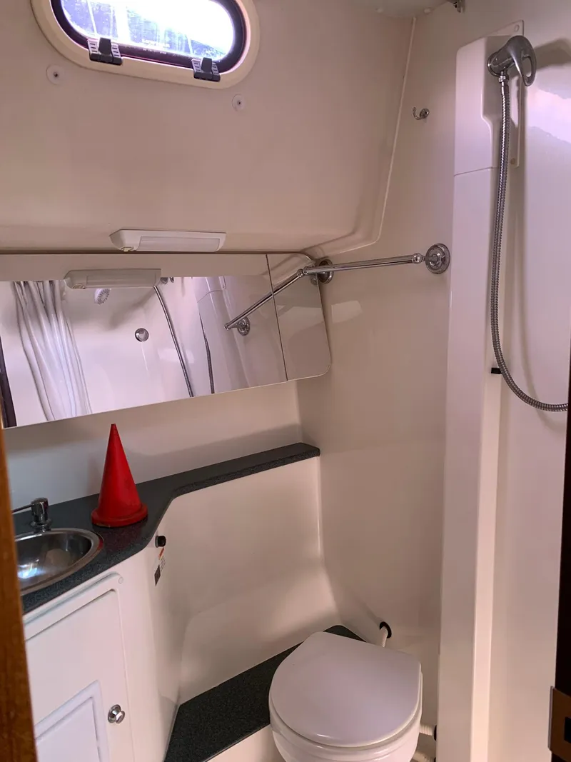 Slide: The Image of 2007 Catalina Morgan 440 yacht bathroom with shower, sink, and toilet. - 32