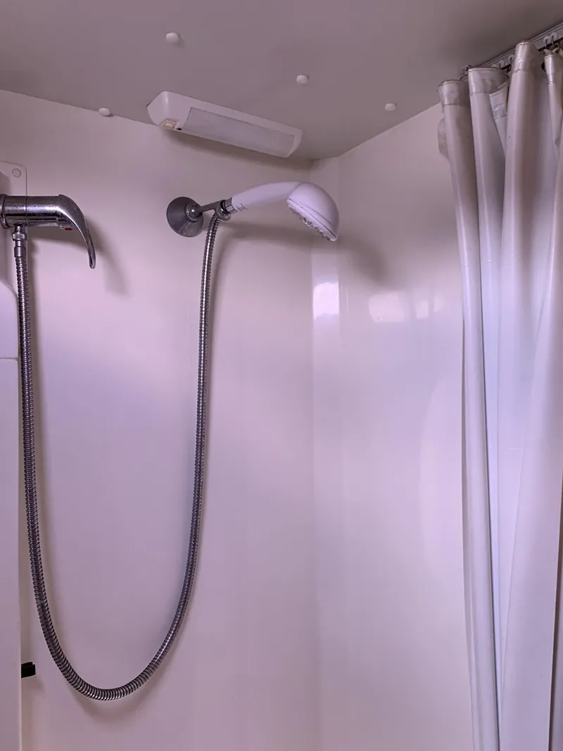 Slide: The Image of Shower area in 2007 Catalina Morgan 440 yacht with white curtain and flexible hose. - 33