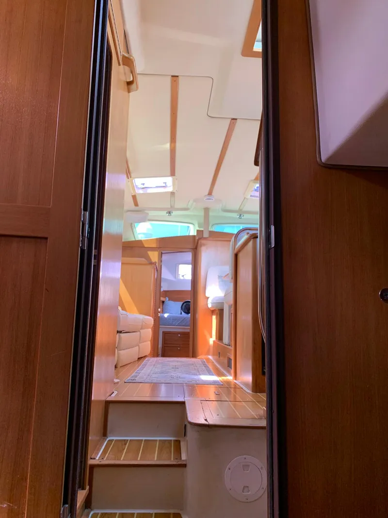 Slide: The Image of Interior view of 2007 Catalina Morgan 440 sailboat, featuring wood finishes and natural light. - 35