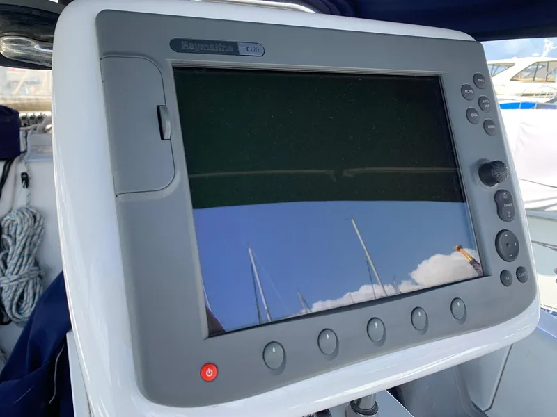 Slide: The Image of Navigation system on a 2007 Catalina Morgan 440 sailboat, featuring a Raymarine display. - 46