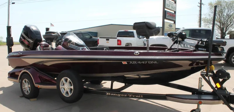 Slide: The Image of 2015 Ranger Z518C Comanche boat on trailer, parked outdoors near dealership. - 3