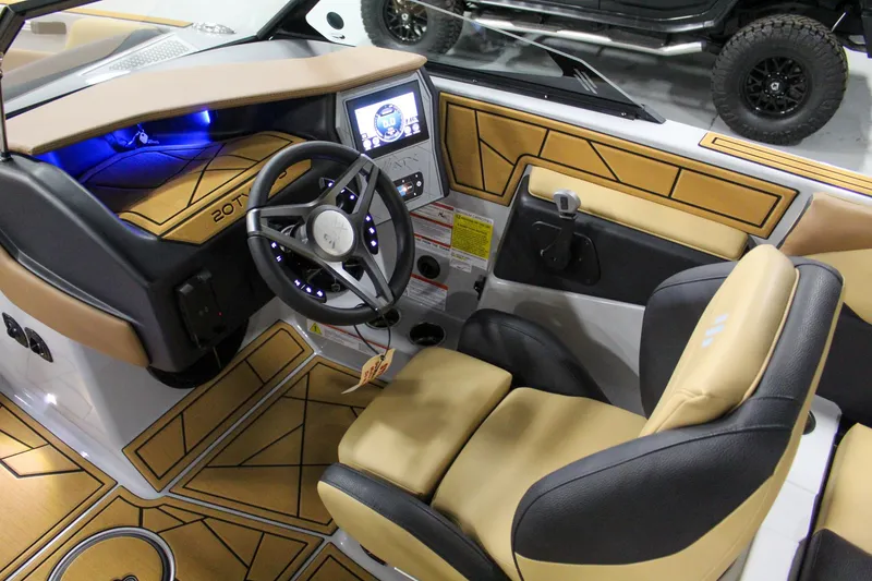 Slide: The Image of Interior of 2025 ATX Surf Boats 20 Type-S, featuring modern dashboard and steering wheel. - 10
