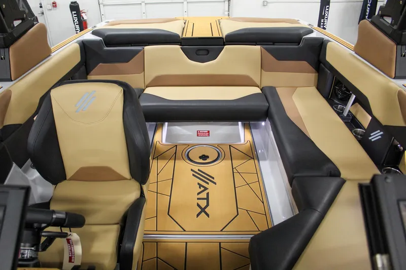 Slide: The Image of 2025 ATX Surf Boats 20 Type-S interior with tan and black seating. - 13