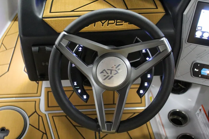 Slide: The Image of Steering wheel of 2025 ATX Surf Boats 20 Type-S with illuminated controls. - 14