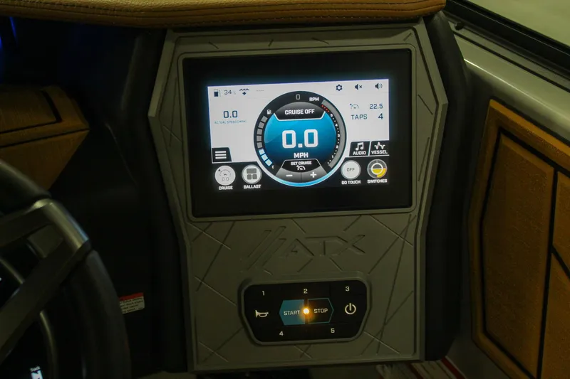 Slide: The Image of 2025 ATX Surf Boats 20 Type-S dashboard with digital display and controls. - 15