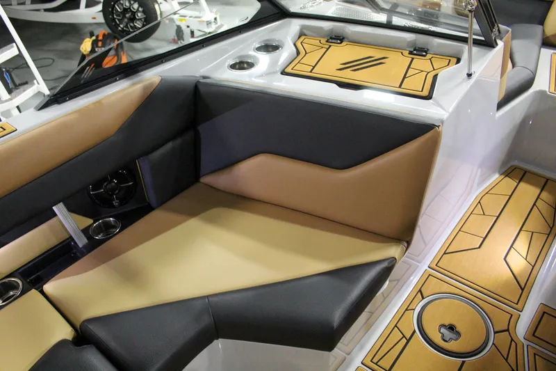 Slide: The Image of 2025 ATX Surf Boats 20 Type-S interior with tan and black seating. - 19