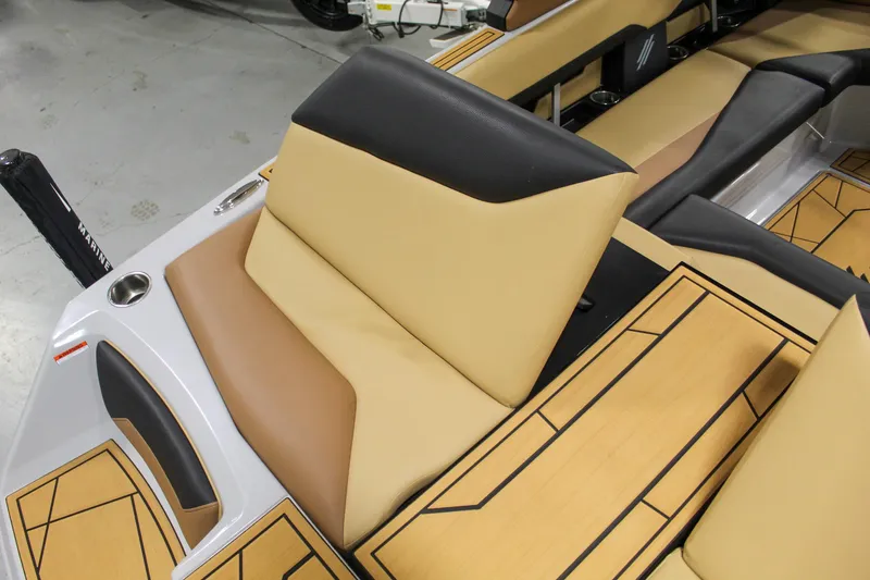 Slide: The Image of 2025 ATX Surf Boats 20 Type-S interior with tan and black seating, modern design. - 24