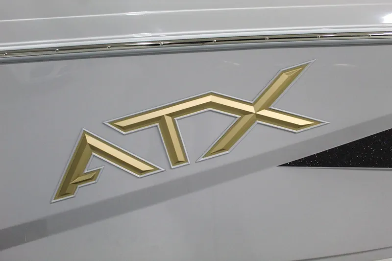 Slide: The Image of ATX Surf Boats 2025 20 Type-S logo in gold on boat exterior. - 26
