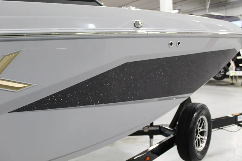 Slide: The Image of 2025 ATX Surf Boats 20 Type-S, sleek design with black accent, on trailer. - 27