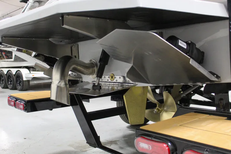 Slide: The Image of 2025 ATX Surf Boats 20 Type-S rear view, showcasing propeller and exhaust system. - 32