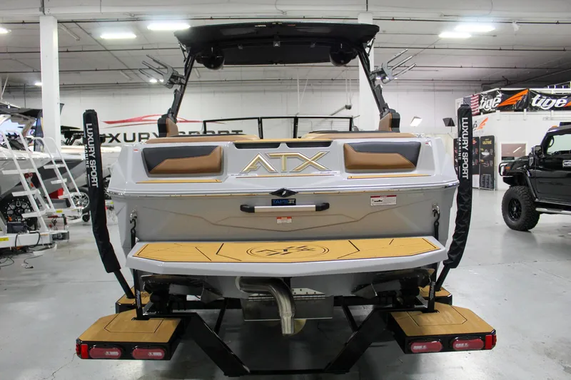 Slide: The Image of 2025 ATX Surf Boats 20 Type-S, rear view in showroom setting. - 4