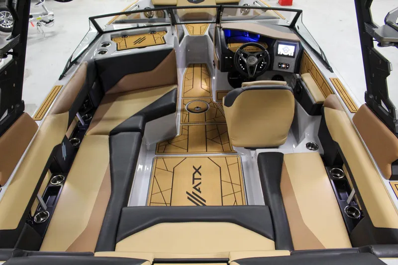 Slide: The Image of 2025 ATX Surf Boats 20 Type-S interior with tan and black seating, modern dashboard, and stylish flooring. - 8