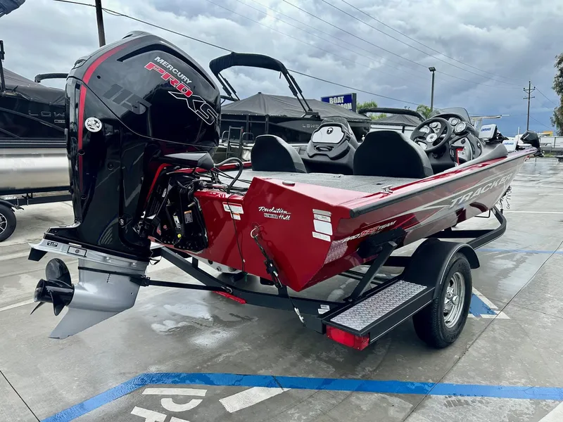 Slide: The Image of 2019 Tracker Pro Team 195 TXW boat with Mercury Pro XS engine on trailer. - 10