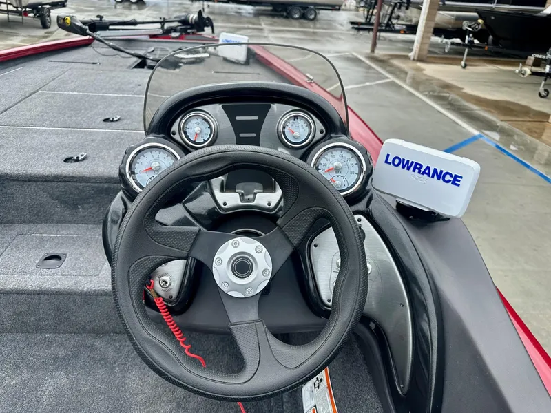 Slide: The Image of 2019 Tracker Pro Team 195 TXW boat dashboard with steering wheel and Lowrance display. - 5