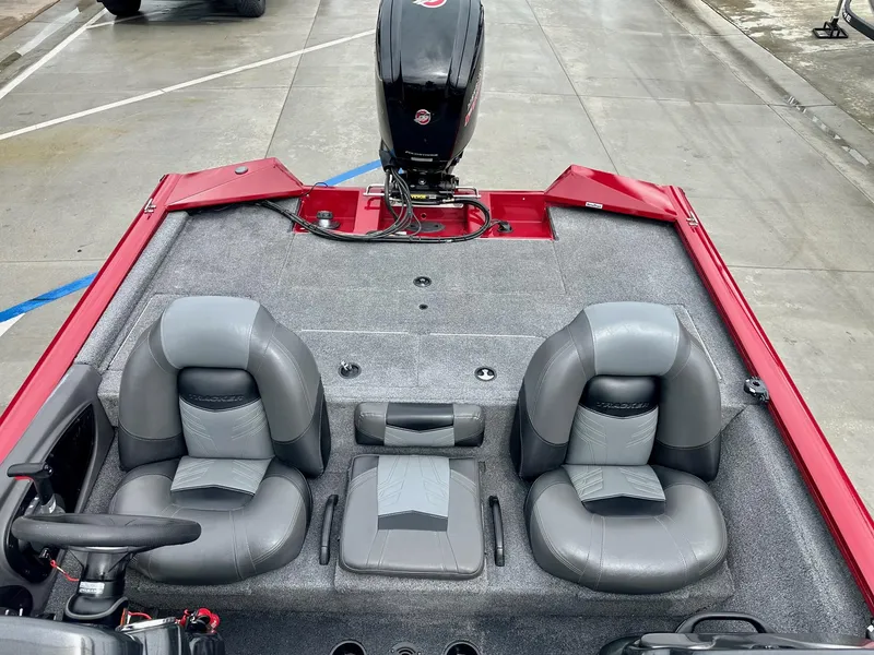 Slide: The Image of 2019 Tracker Pro Team 195 TXW boat interior with gray seats and red accents. - 7
