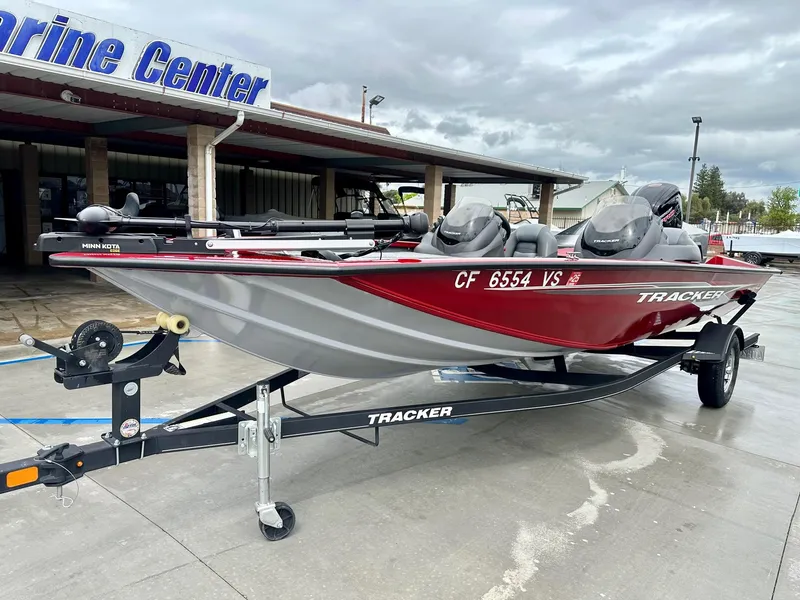 Slide: The Image of 2019 Tracker Pro Team 195 TXW boat on trailer at marine center. - 8