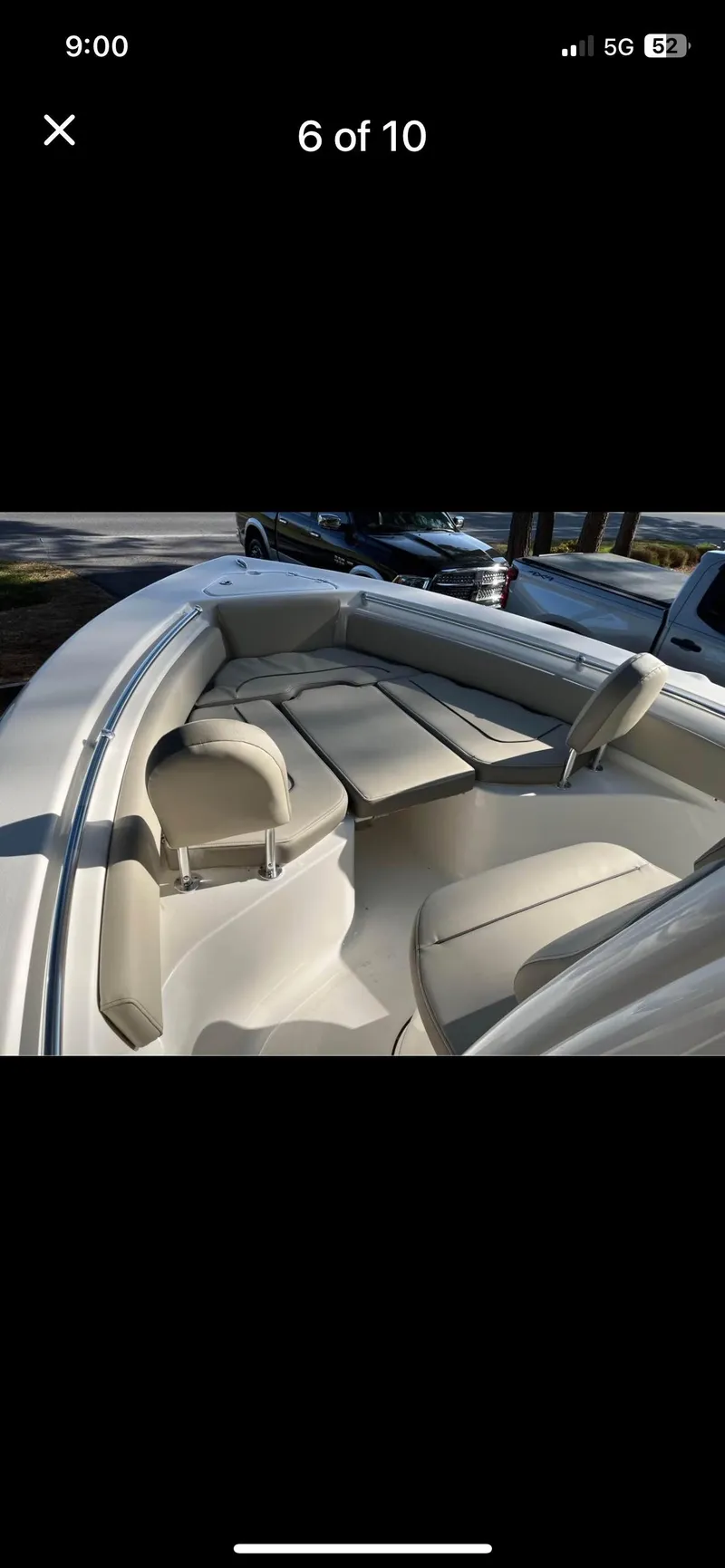 Slide: The Image of 2022 Key West 219 FS boat interior with cushioned seating and storage compartments. - 6