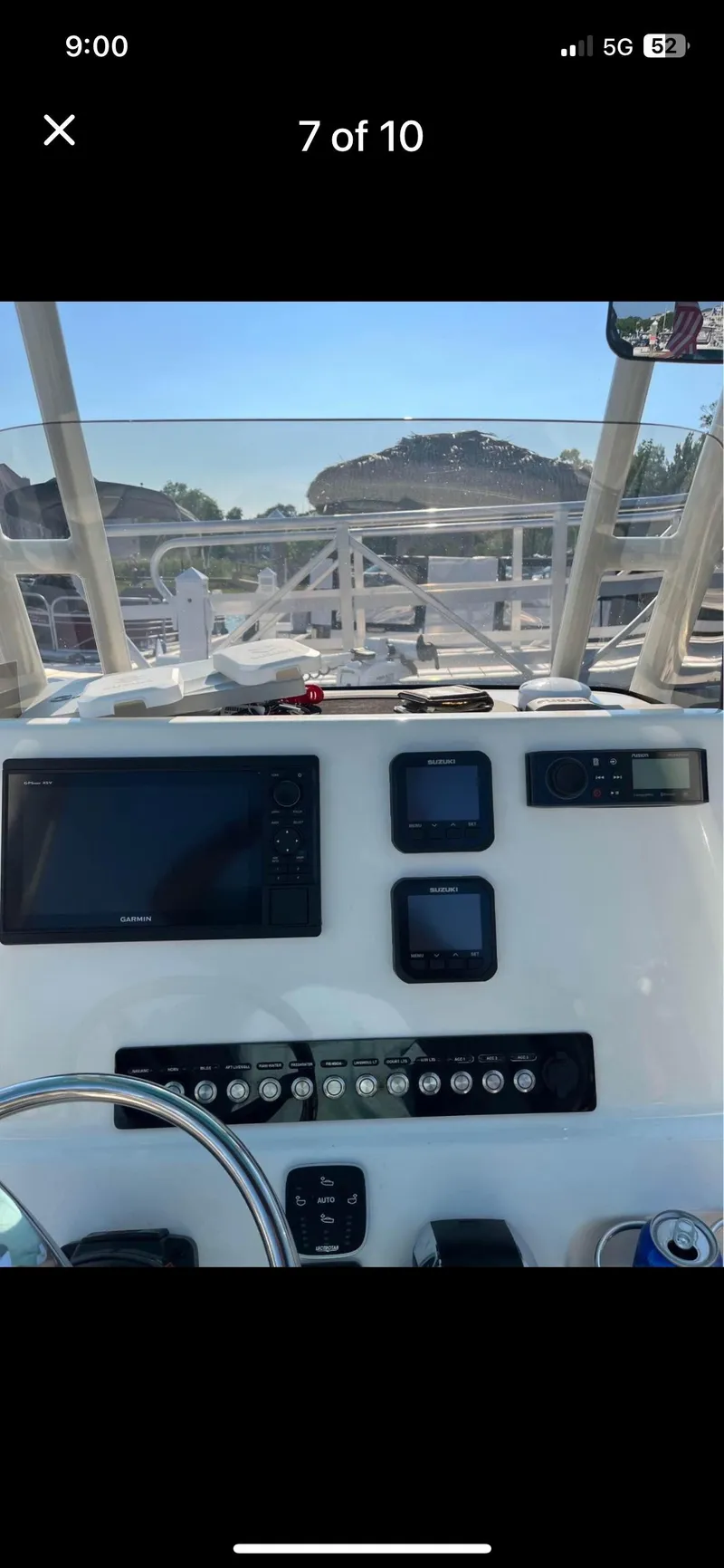 Slide: The Image of 2022 Key West 219 FS boat dashboard with navigation screens and controls. - 8