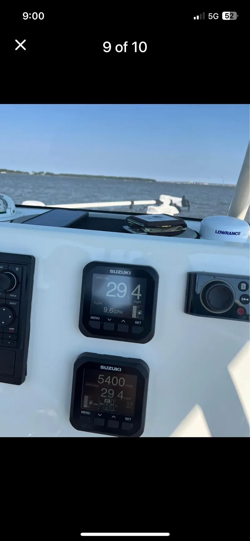 Slide: The Image of 2022 Key West 219 FS boat dashboard with navigation instruments on a sunny day. - 9