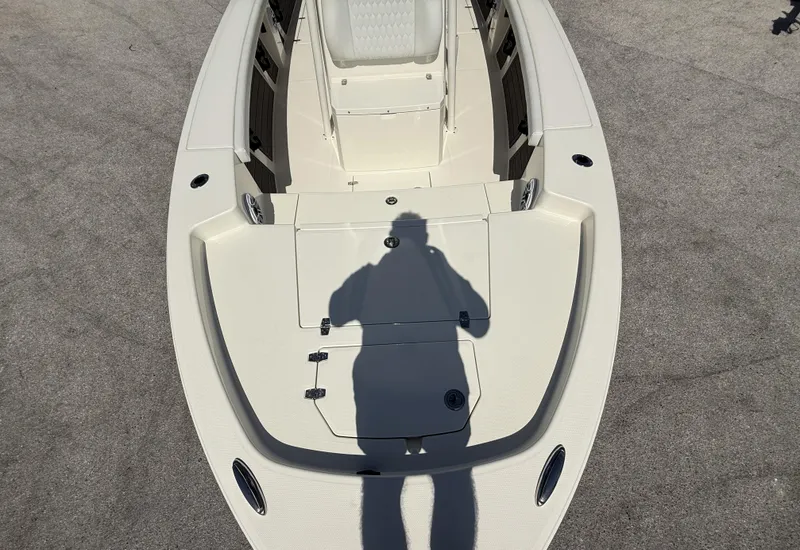 Slide: The Image of 2025 Pathfinder 2400 Open boat deck with shadow, showcasing spacious design and seating. - 10