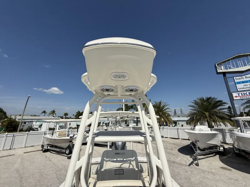 Slide: The Image of 2025 Pathfinder 2400 Open boat displayed outdoors under clear blue sky. - 13