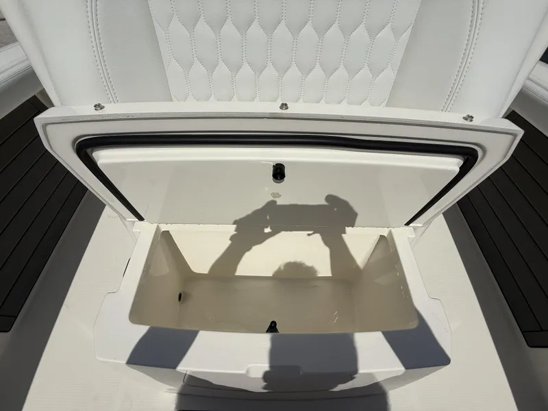 Slide: The Image of Open storage compartment on 2025 Pathfinder 2400 Open boat, with shadow reflection. - 17