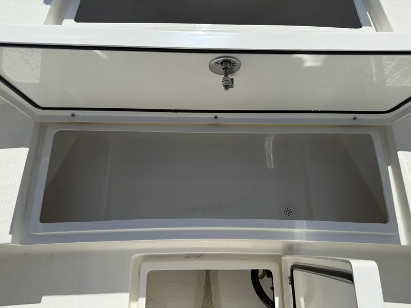 Slide: The Image of Open storage compartment of 2025 Pathfinder 2400 Open boat, showcasing spacious interior. - 20