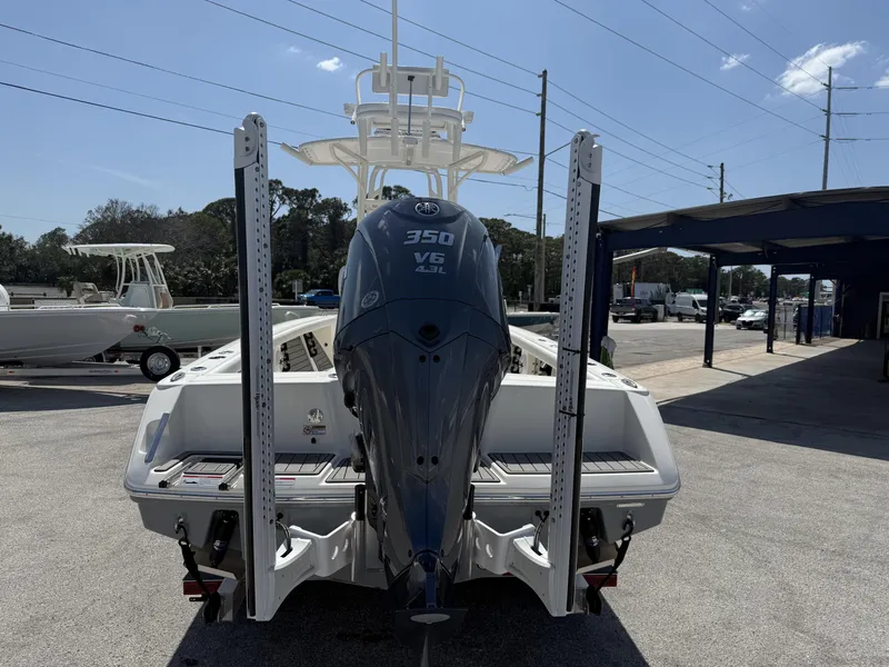 Slide: The Image of 2025 Pathfinder 2400 Open boat with Yamaha 350 V6 engine, parked outdoors. - 26