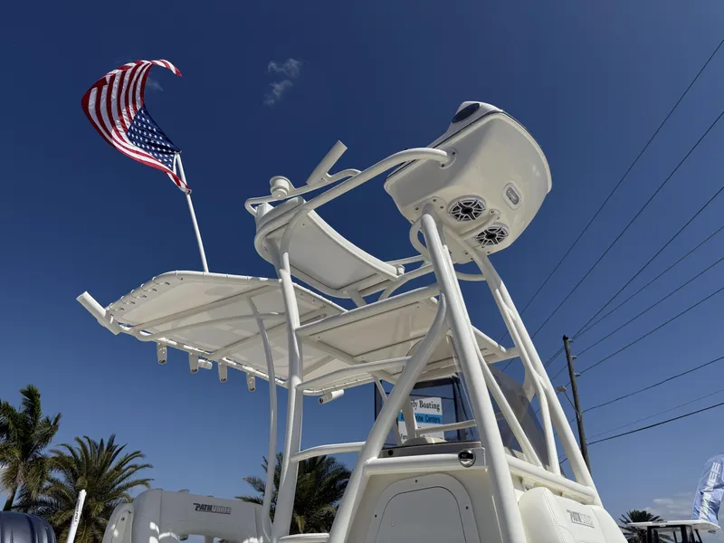 Slide: The Image of 2025 Pathfinder 2400 Open boat with American flag, clear sky background. - 30