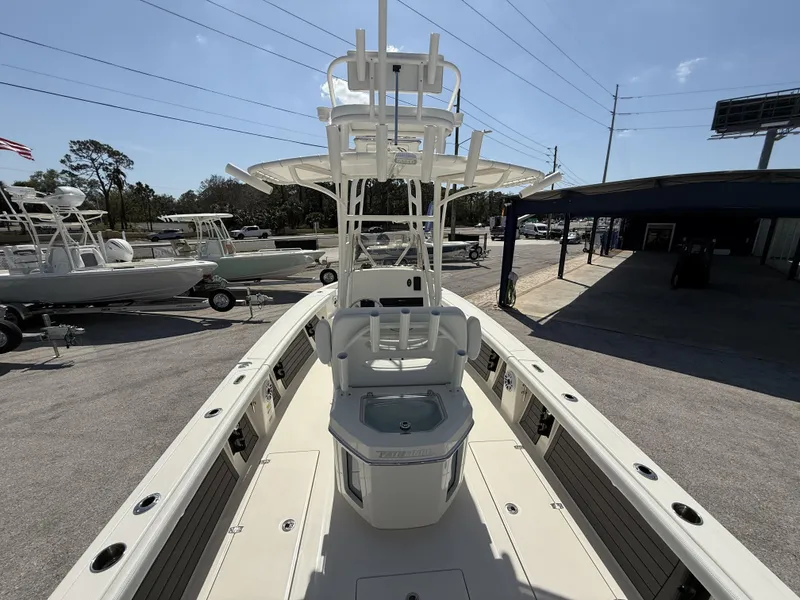 Slide: The Image of 2025 Pathfinder 2400 Open boat displayed in a marina under clear skies. - 33