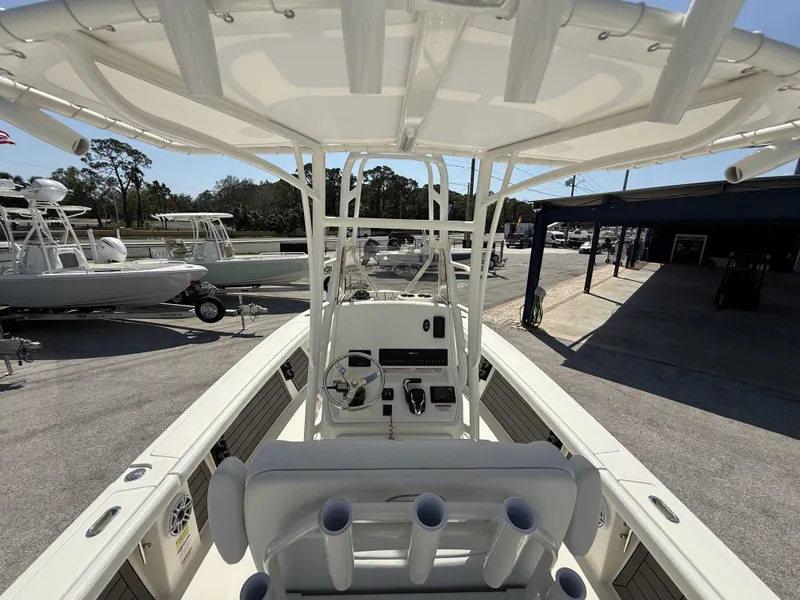 Slide: The Image of 2025 Pathfinder 2400 Open boat interior with steering console and rod holders. - 34